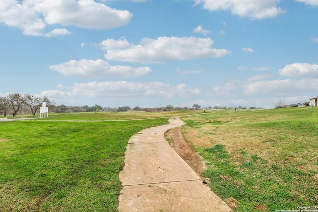 view of community featuring a rural view and a lawn