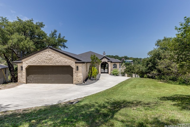 view of front facade with a garage and a front yard