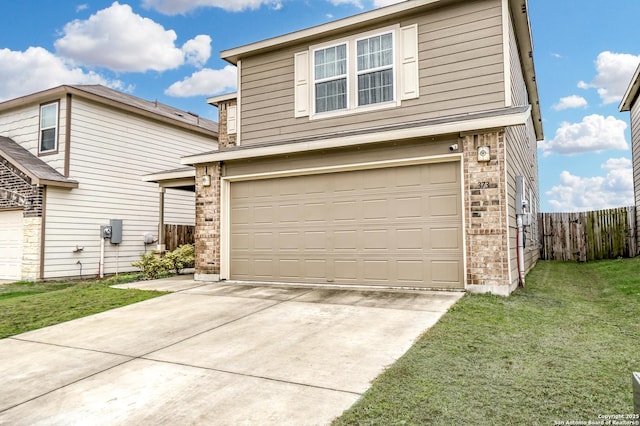 view of front of home featuring a garage and a front lawn