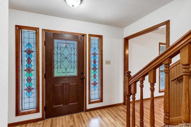 foyer entrance with light wood-type flooring