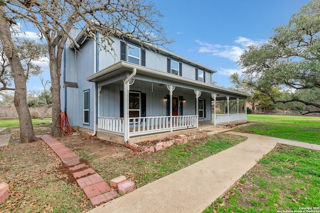 view of front of house featuring a porch and a front lawn