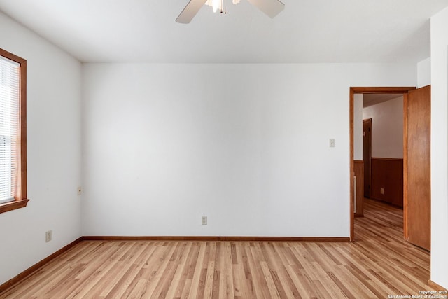 spare room featuring ceiling fan and light hardwood / wood-style floors