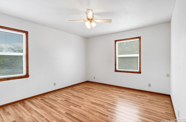 unfurnished room with light hardwood / wood-style flooring and ceiling fan