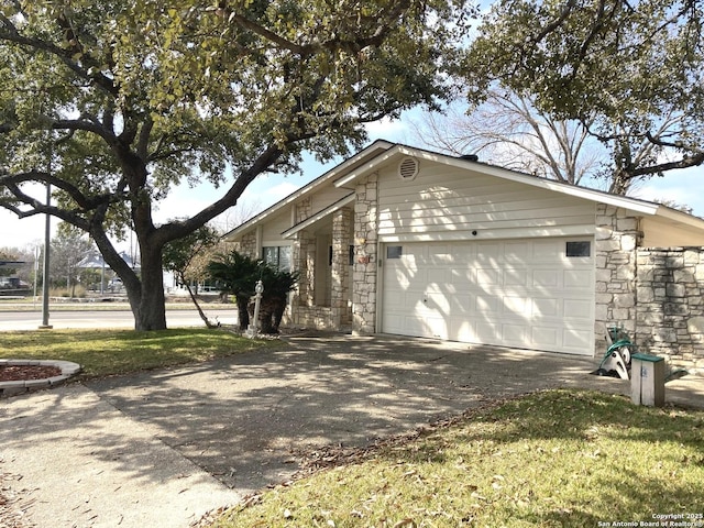 view of side of home with a garage