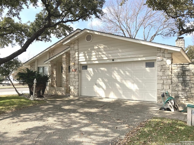 view of side of home featuring a garage