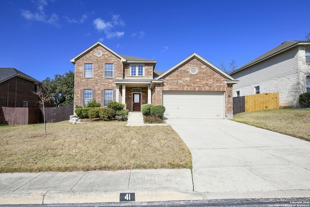 view of front of home with a garage and a front lawn