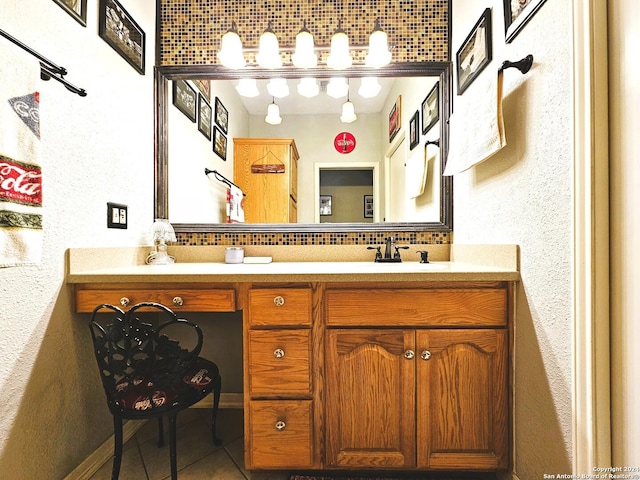 full bath with tile patterned flooring, a sink, backsplash, and double vanity