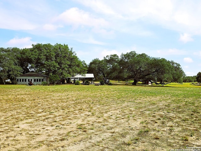 view of yard with a rural view