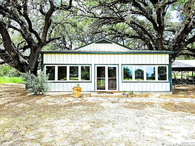 view of front of home featuring a carport and board and batten siding