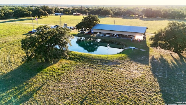 aerial view with a rural view and a water view