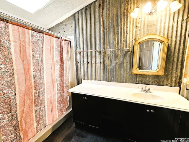 bathroom with a textured ceiling, a shower with shower curtain, lofted ceiling, and vanity