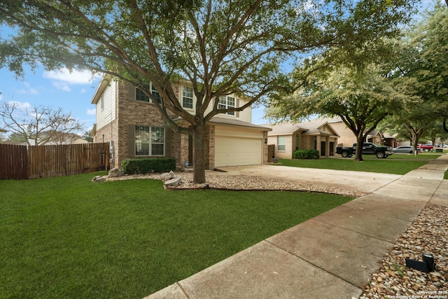 view of front of property with a garage and a front yard