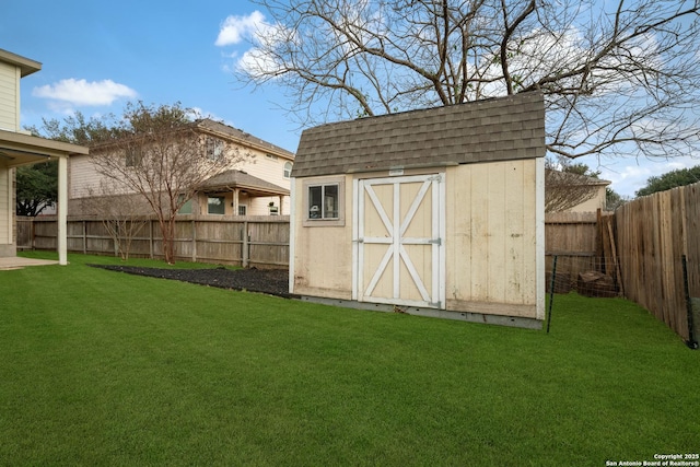 view of outdoor structure featuring a lawn