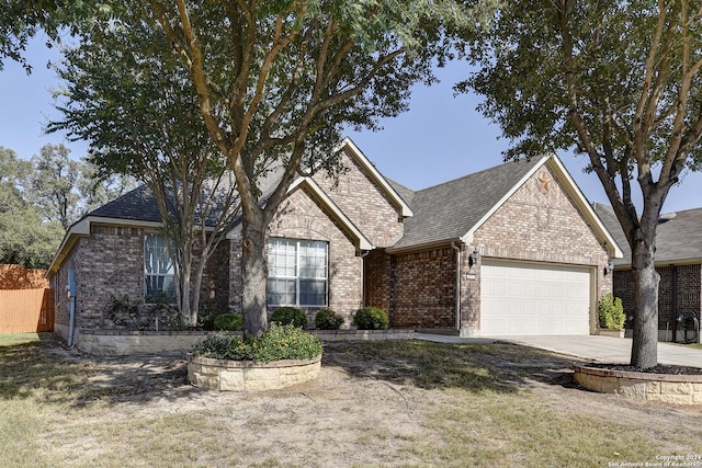 single story home with a garage and a front yard