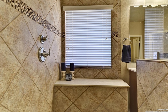 bathroom with a tile shower