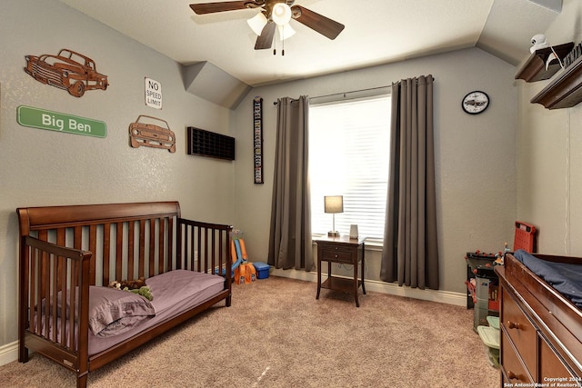 bedroom featuring ceiling fan, lofted ceiling, and light carpet