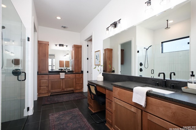 bathroom with walk in shower, tile patterned floors, and a wealth of natural light