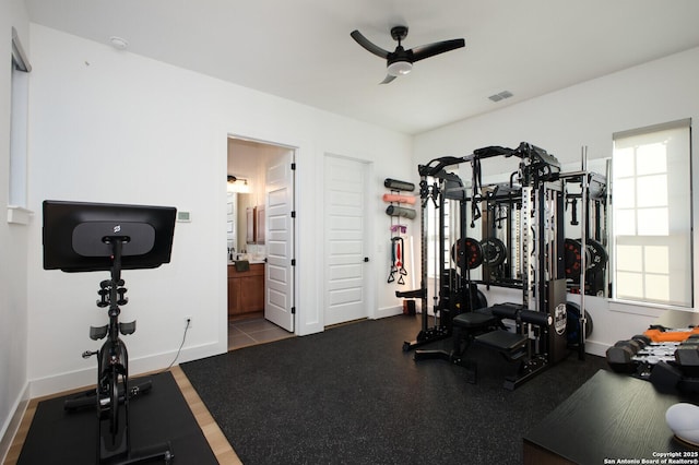 workout room featuring ceiling fan