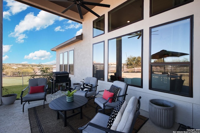 view of patio / terrace with ceiling fan and a grill