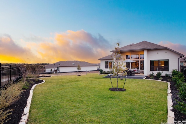 exterior space featuring a patio and a lawn