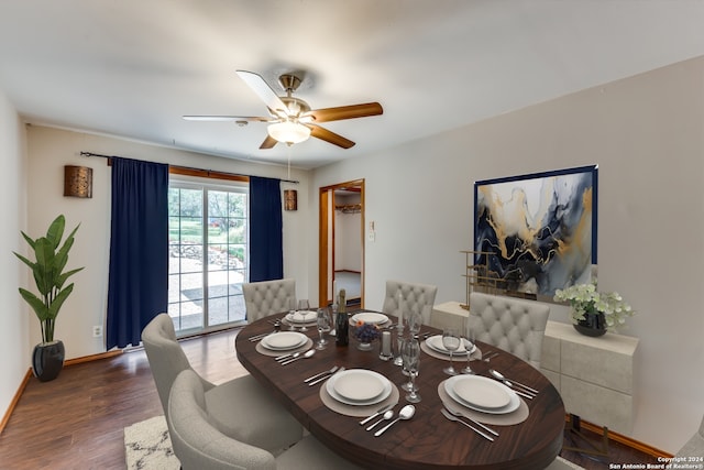 dining space featuring dark wood-type flooring and ceiling fan