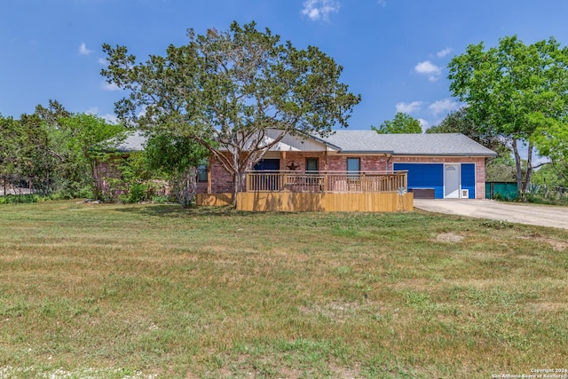 view of front of home with a garage and a front lawn