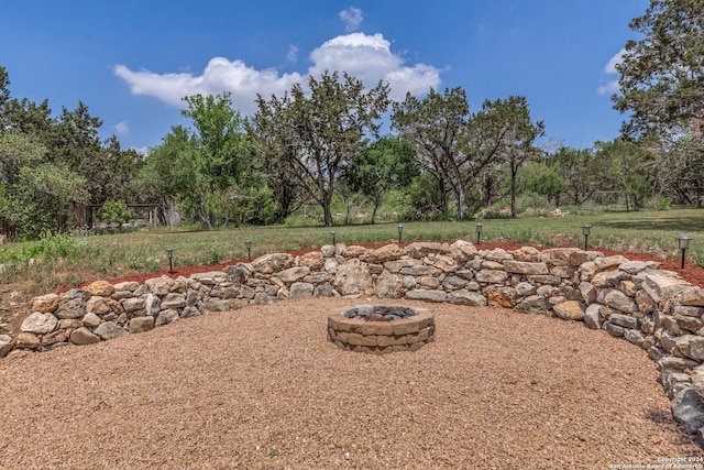 view of yard featuring a fire pit