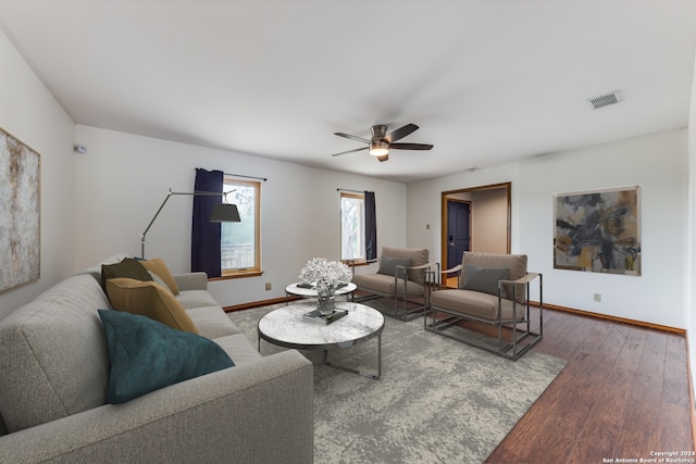 living room with hardwood / wood-style flooring and ceiling fan