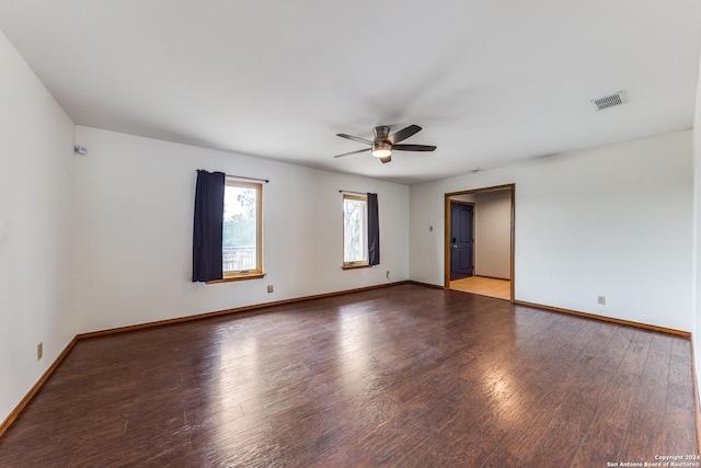 empty room featuring hardwood / wood-style flooring and ceiling fan