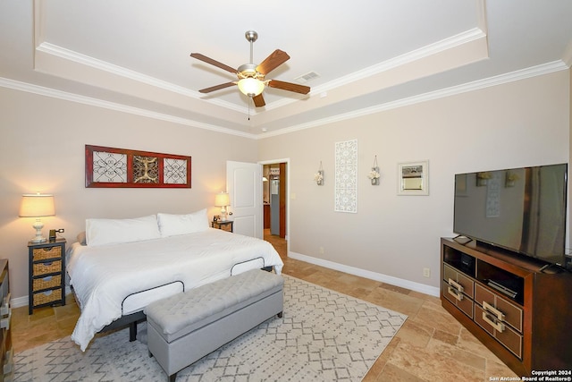 bedroom featuring crown molding, ceiling fan, and a raised ceiling