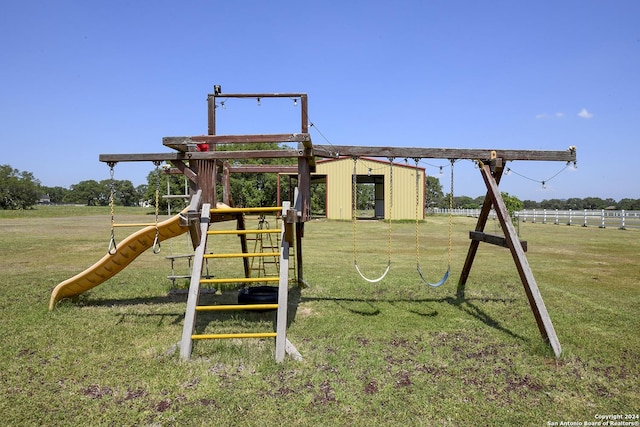 view of play area with a rural view and a lawn