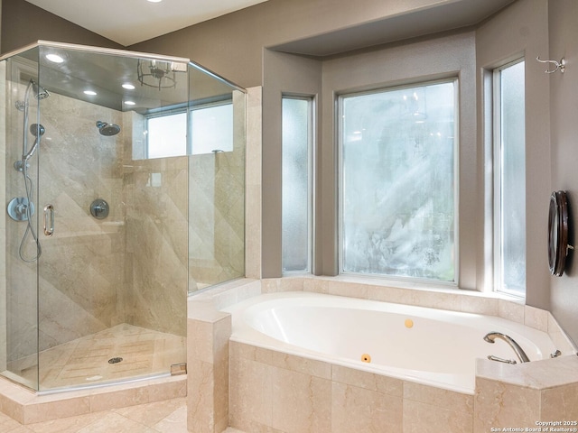 bathroom with separate shower and tub