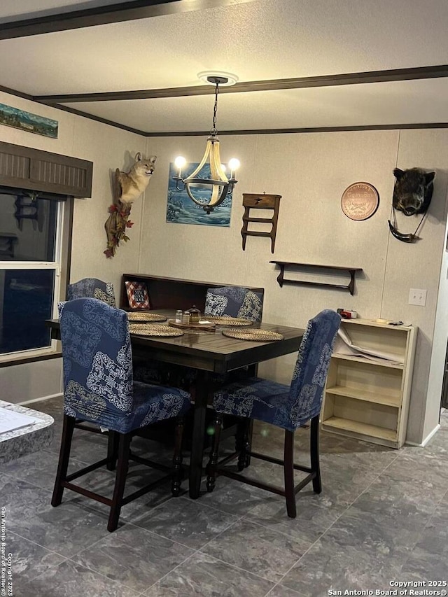 dining area with a textured ceiling and a notable chandelier