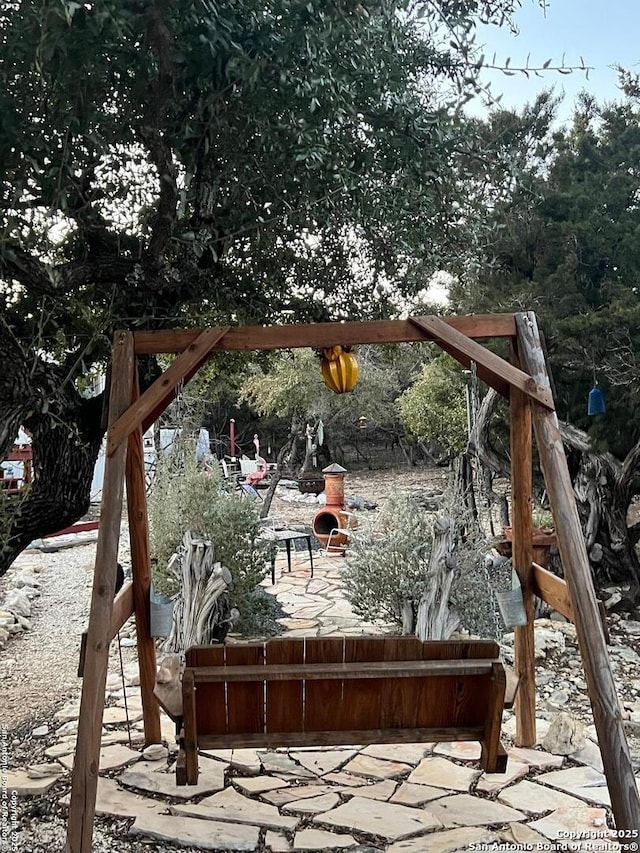 wooden terrace featuring a patio area