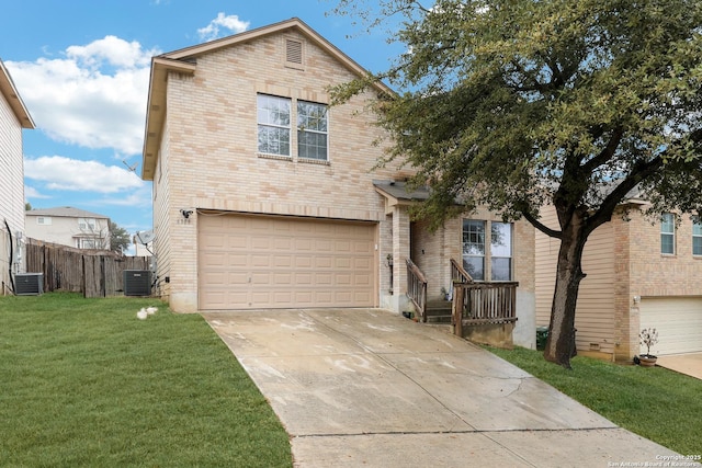 front of property with a garage, a front yard, and central air condition unit