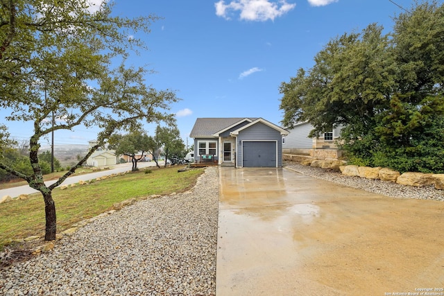 view of front of home featuring a garage and a front lawn