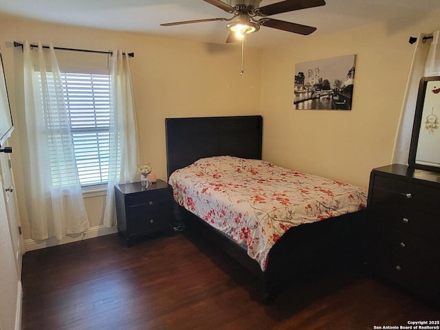 bedroom with dark wood-type flooring and ceiling fan