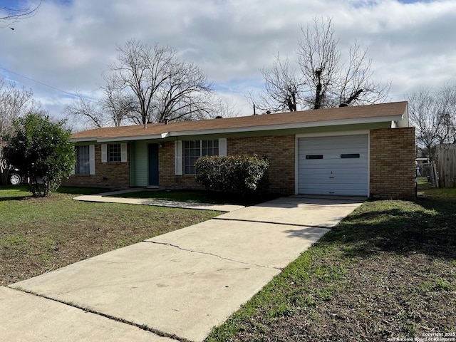 single story home featuring a garage and a front lawn