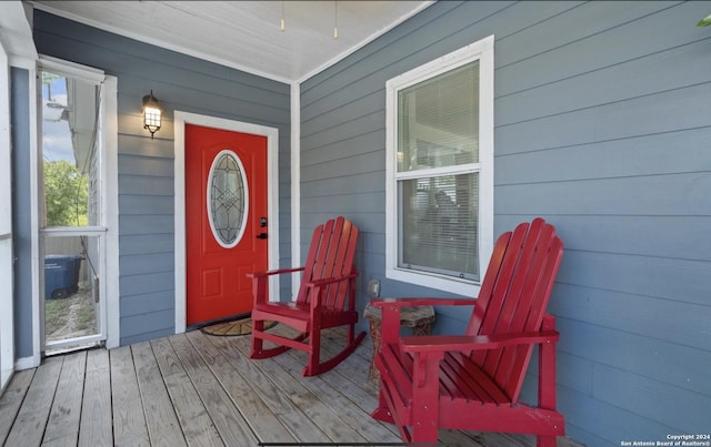 view of exterior entry featuring covered porch