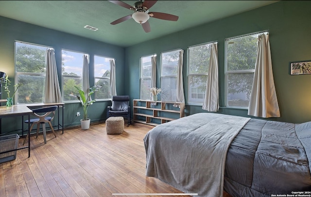 bedroom featuring ceiling fan and light hardwood / wood-style floors