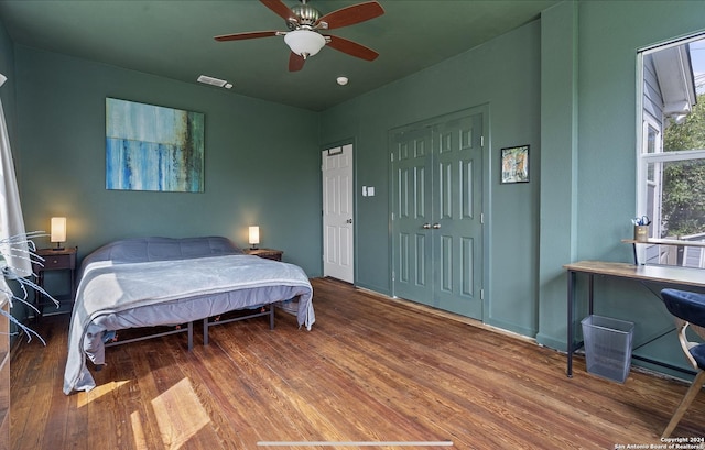 bedroom with hardwood / wood-style flooring and ceiling fan