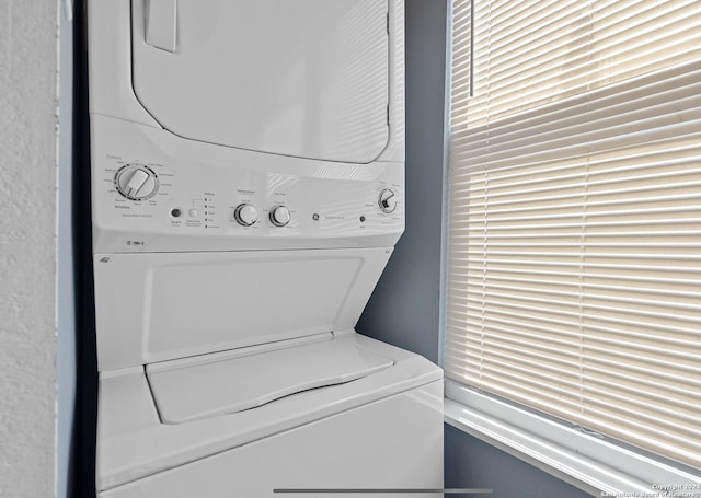 washroom with stacked washer / dryer