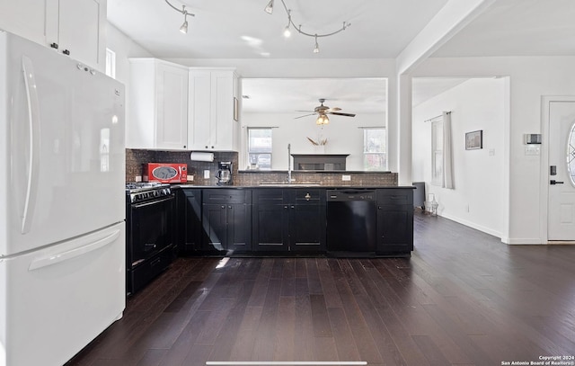 kitchen with tasteful backsplash, dark wood-type flooring, white cabinets, and black appliances