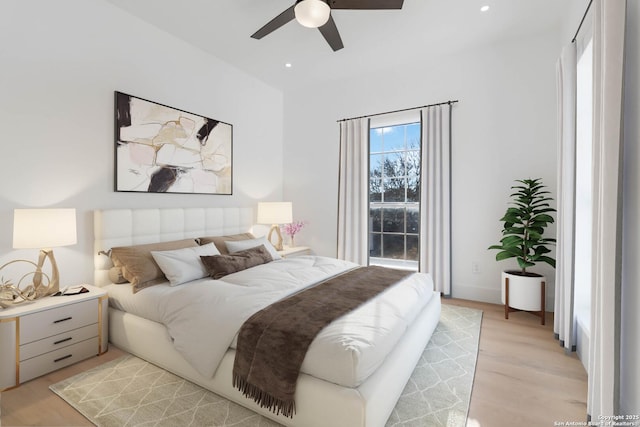 bedroom featuring ceiling fan and light hardwood / wood-style flooring