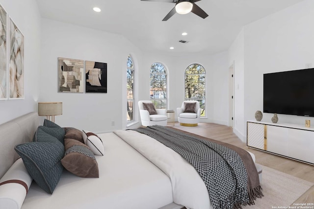 bedroom with ceiling fan and light wood-type flooring