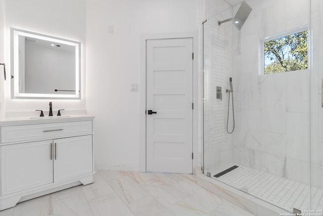 bathroom with vanity and a tile shower