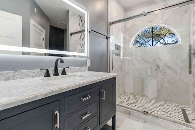 bathroom with vanity and an enclosed shower