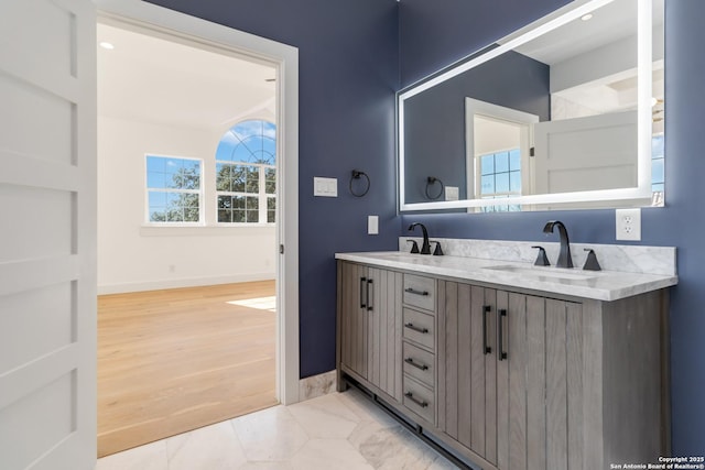 bathroom with vanity and wood-type flooring