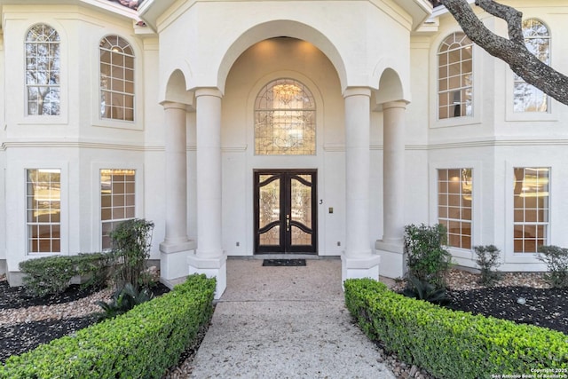 view of exterior entry featuring french doors