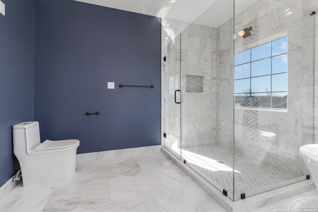 bathroom with an enclosed shower and toilet